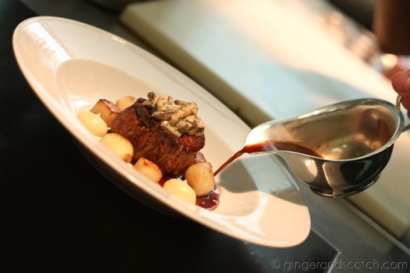Pouring the red wine sauce